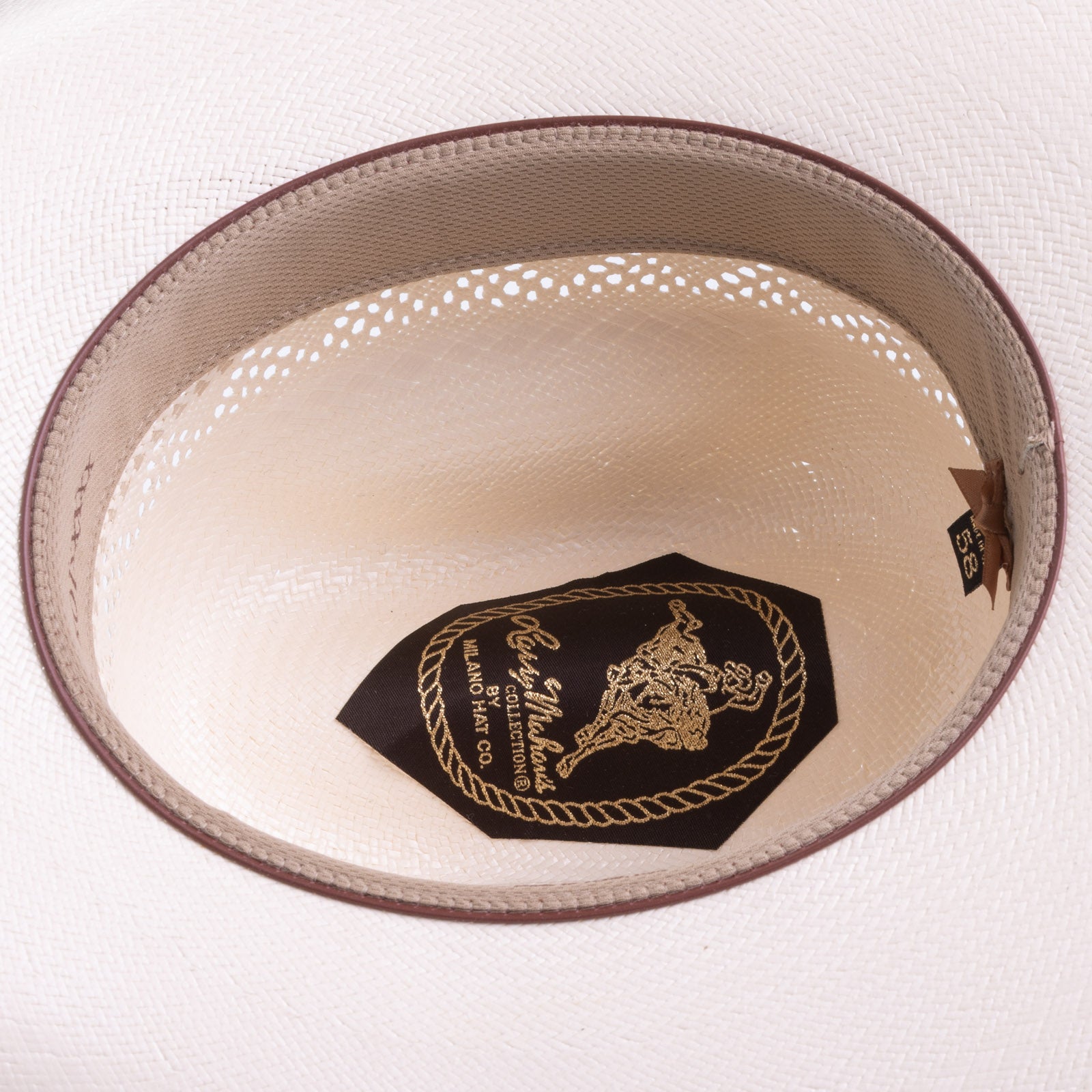 10X Durant ivory cowboy hat closeup of the underside with yellowish interior, light brown trim and dark brown lettering