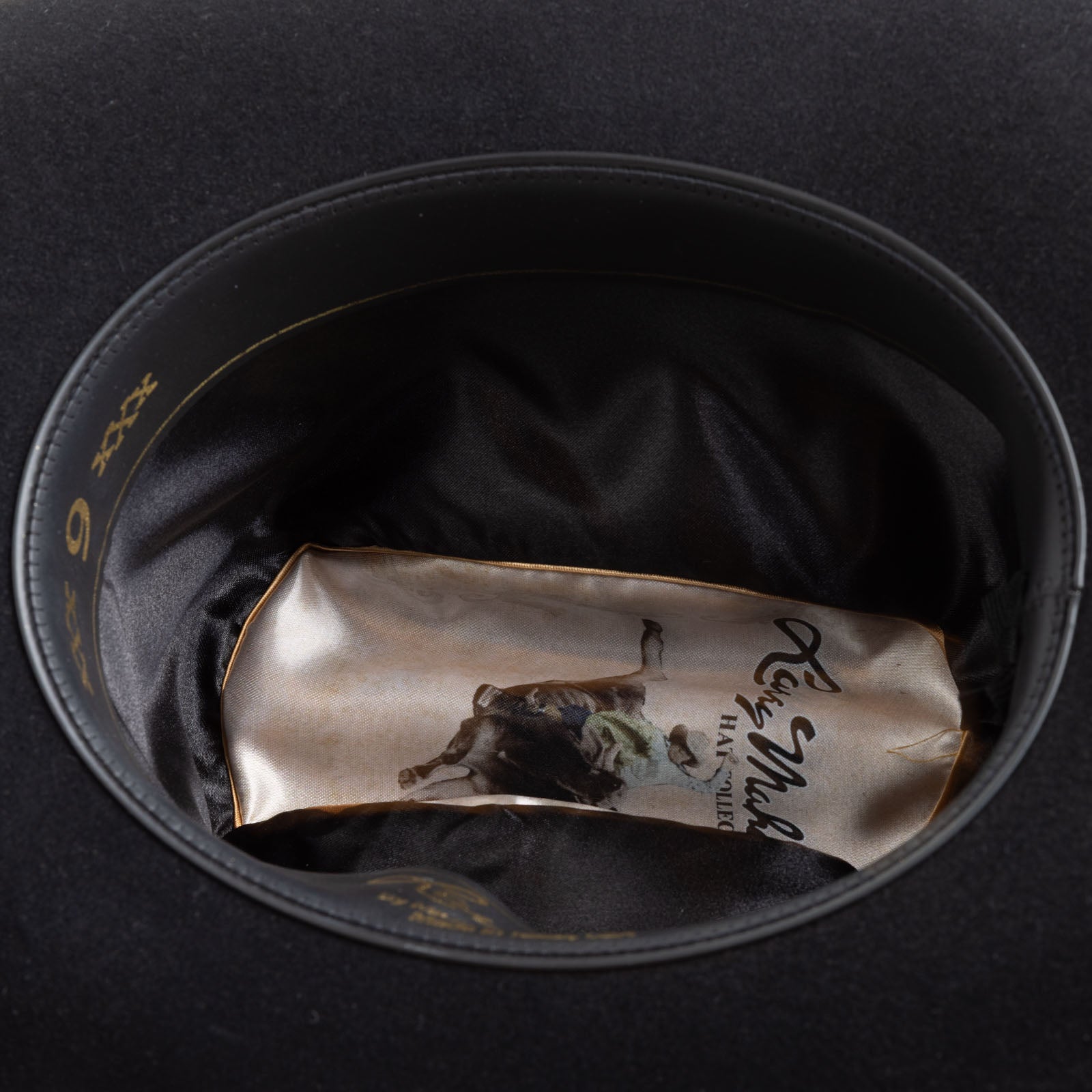 6X Real black cowboy hat under side angle