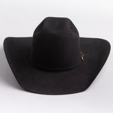 A black felt cowboy hat with a small gold buckle detail on the band, photographed on a clean light gray background