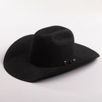 A black felt cowboy hat with a small silver decorative buckle on the band, photographed on a clean light gray background