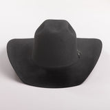 A black felt cowboy hat with a small silver decorative buckle on the band, photographed on a clean light gray background