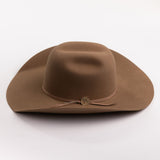 A brown felt cowboy hat with a matching band and a small gold-toned decorative button, photographed on a clean light gray background