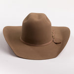 A brown felt cowboy hat with a matching band and a small gold-toned decorative button, photographed on a clean light gray background