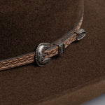 3X Stockman brown cowboy hat close up left-side angle