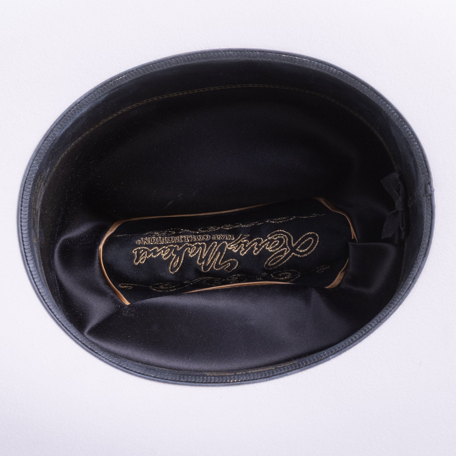 30X El Rey white cowboy hat closeup of the underside with black interior, gold trim and lettering