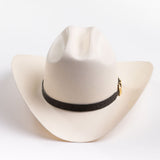 An off-white cowboy hat with a black band and gold buckle, photographed on a clean light gray background