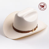 A cream-colored cowboy hat with a brown leather band and gold buckle, photographed on a clean light gray background - ostrich band in red is stamped in the top right corner of the photo