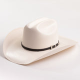 An off-white cowboy hat with a black band and a silver buckle, photographed on a clean white background