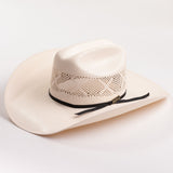 An off-white colored woven cowboy hat with a black ribbon band and a small gold logo tag, photographed on a clean white background