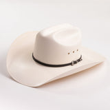An off-white cowboy hat with a black band and silver buckle, photographed on a clean white background