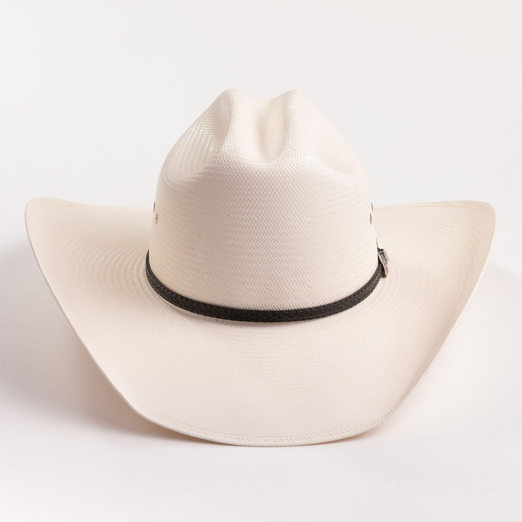 An off-white woven cowboy hat with a black band around the crown, photographed against a clean white background