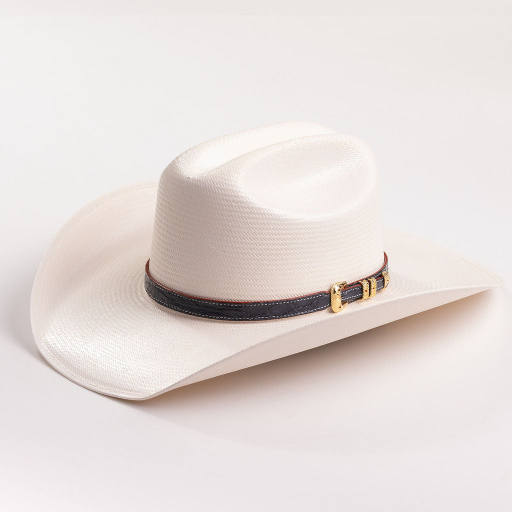 Ivory cowboy hat with a decorative band on a light gray background