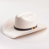 Ivory cowboy hat with a decorative band on a light gray background