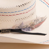 Close-up of a straw hat with decorative band and feather, featuring the brand 'Larry Mahan's'