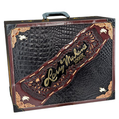 Decorative suitcase with intricate designs and 'Larry Mahan' branding on a white background