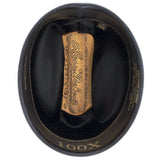 100X Independencia belly cowboy hat underside with brown band with light brown text and black interior gold gold center with golden Larry Mahan bottom-most part