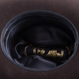 5X Dorado brown cowboy hat closeup of the underside with black interior and gold lettering