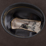 5X Fort Worth brown cowboy hat closeup of the underside with black interior, gold trim and lettering