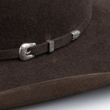 5X Fort Worth brown cowboy hat closeup of buckle in silver with small intricate etchings on a brown band